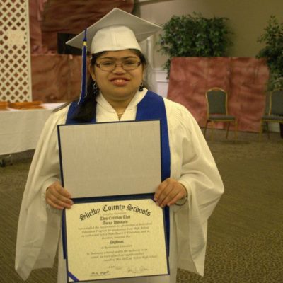 Woman with special needs holding her diploma